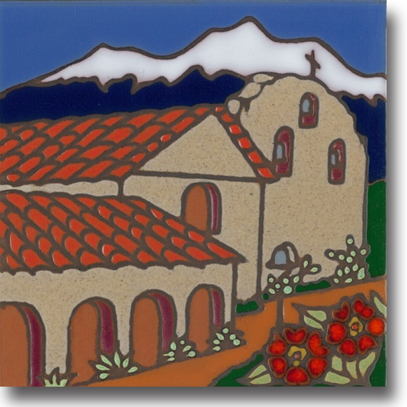 Ceramic tile with original art image of Mission Santa Ines Virgen y Martir hand painted & kiln fired creating vivid, jewel-like colors. American made, hand crafted tile has a hardboard backing making it suitable as a trivet, original wall art or without the backing,  combine several to form a tile mosaic back splash.