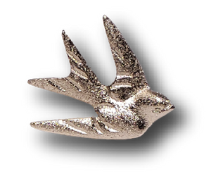 A brass Mission San Juan Capistrano Swallow in silver brass with a magnet. 2.5" x 2".  The swallow is a symbol of the miracle of the Swallows of Capistrano which takes place each year on March 19 (St. Joseph’s Day)